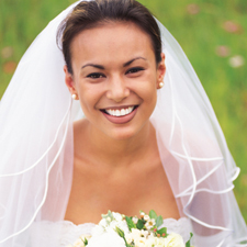 Smiling woman in wedding dress